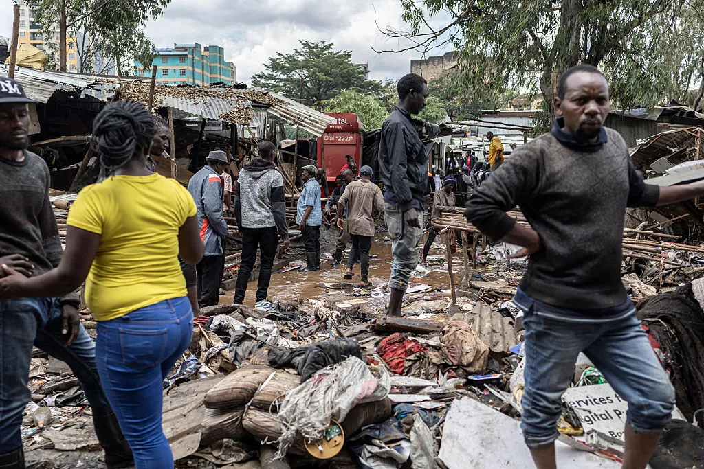 People look for salvageables in downtown Nairobi following heavy flooding around Nairobi on March 7.