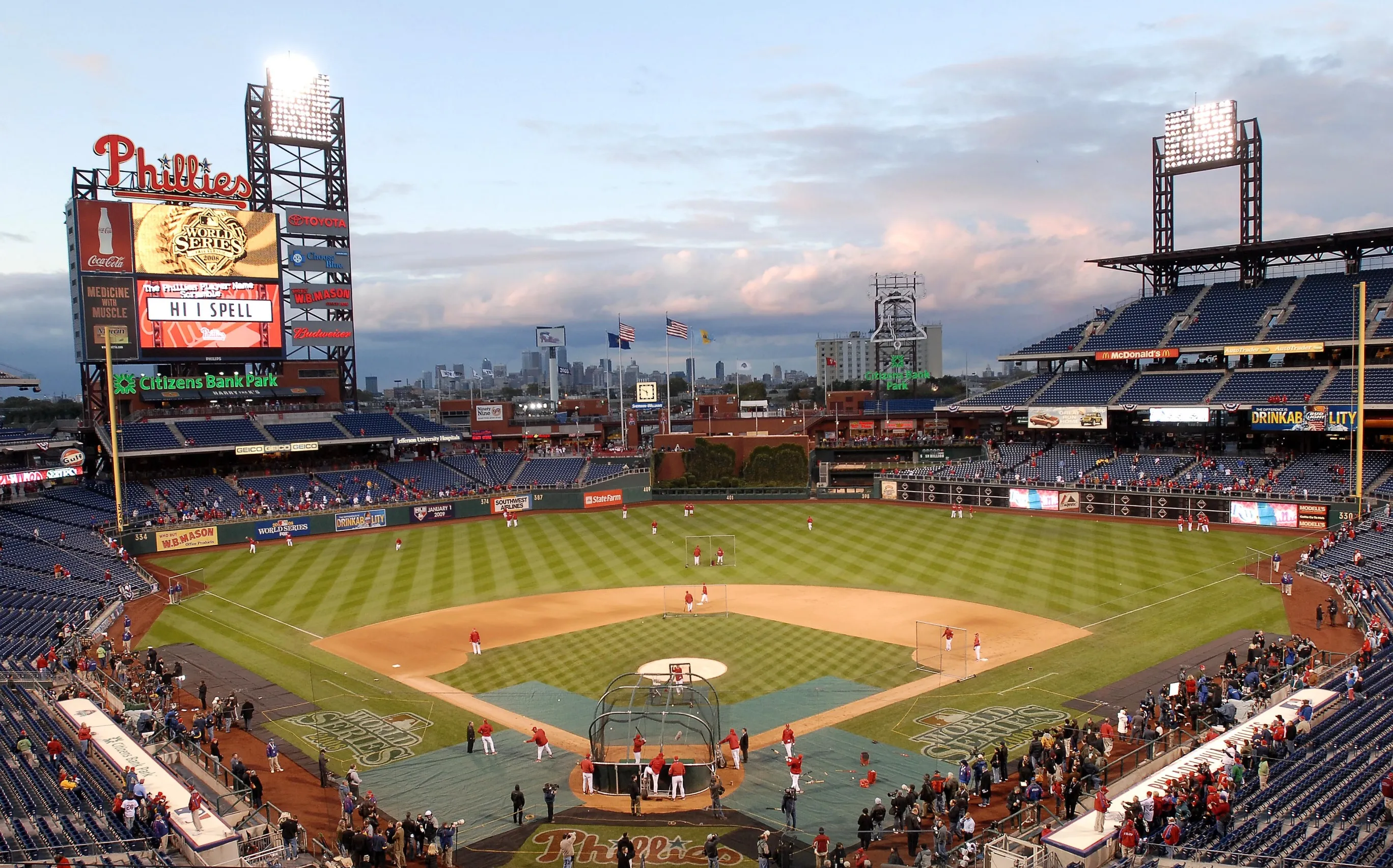 Fans watch as the Philadelphia Phillies take fielding and batting practice before the continuation of game five of the Major League Baseball (MLB) World Series against the Tampa Bay Rays at Citizens Bank Park in Philadelphia, Pennsylvania, U.S., on Wednesday, Oct. 29, 2008.