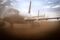 Planes with their engines and windows covered sit at a storage facility as a storm blows dust at Alice Springs Airport