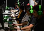 Attendees play online video games in the Samsung Japan Corp. and Nexon Co. collaboration booth at the Tokyo Game Show 2017 at Makuhari Messe in Chiba, Japan, on Friday, Sept. 22, 2017. The game show runs through Sept. 24.