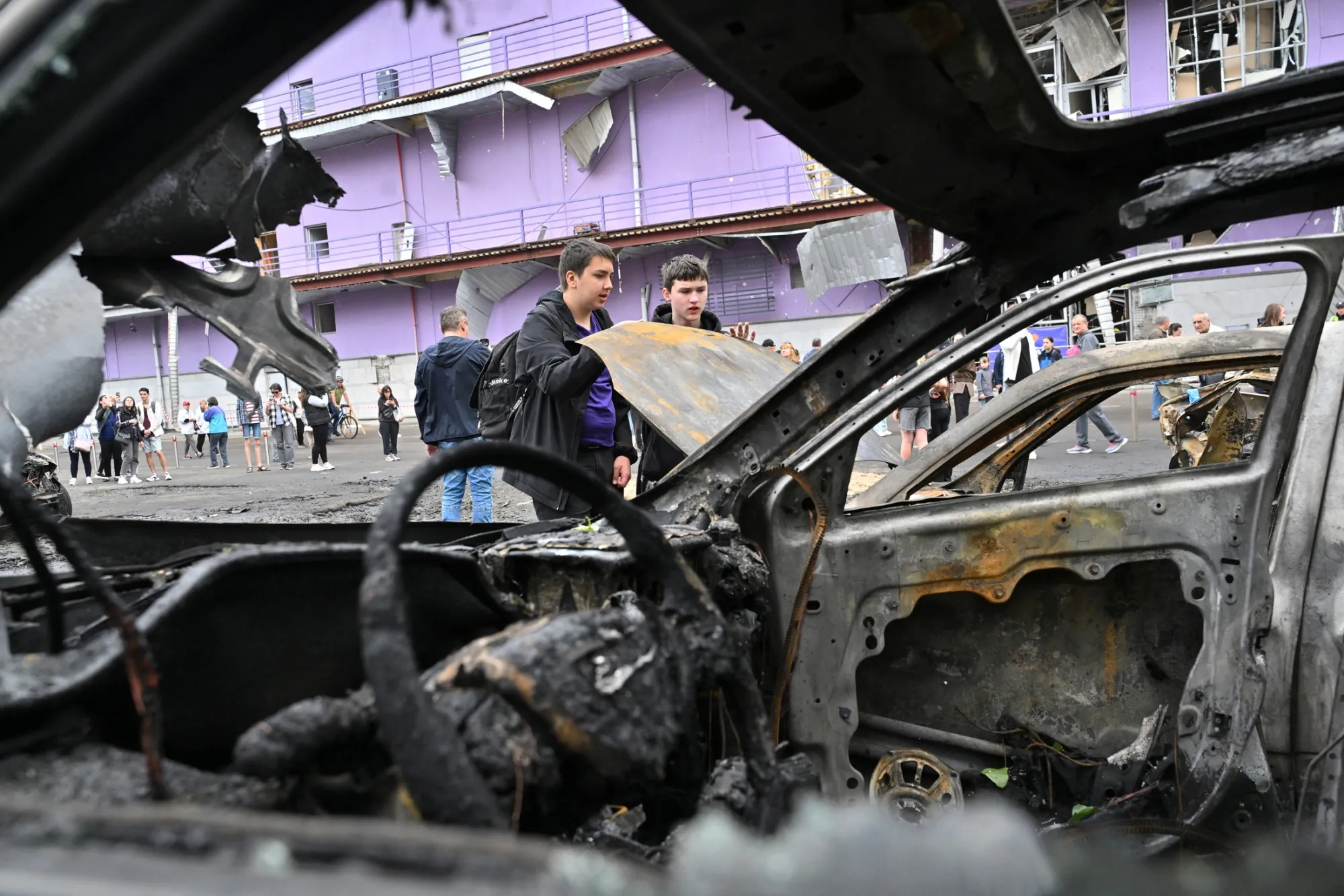 Burned out vehicles outside a shopping mall following a Russian drone attack on Kyiv, on May 4