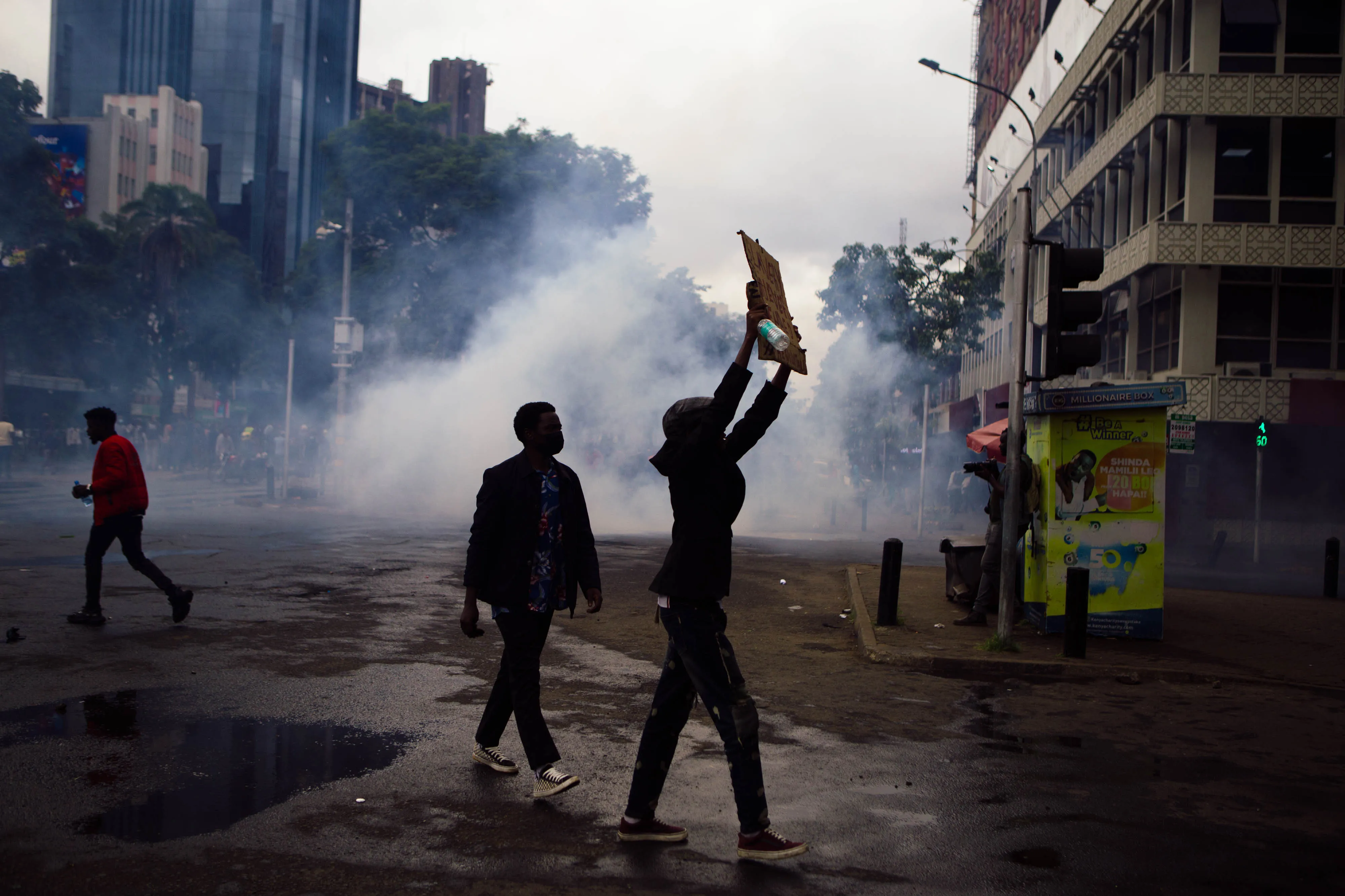 Police use tear gas to disperse protesters during a demonstration against the proposed government finance bill in Nairobi, on June 20.