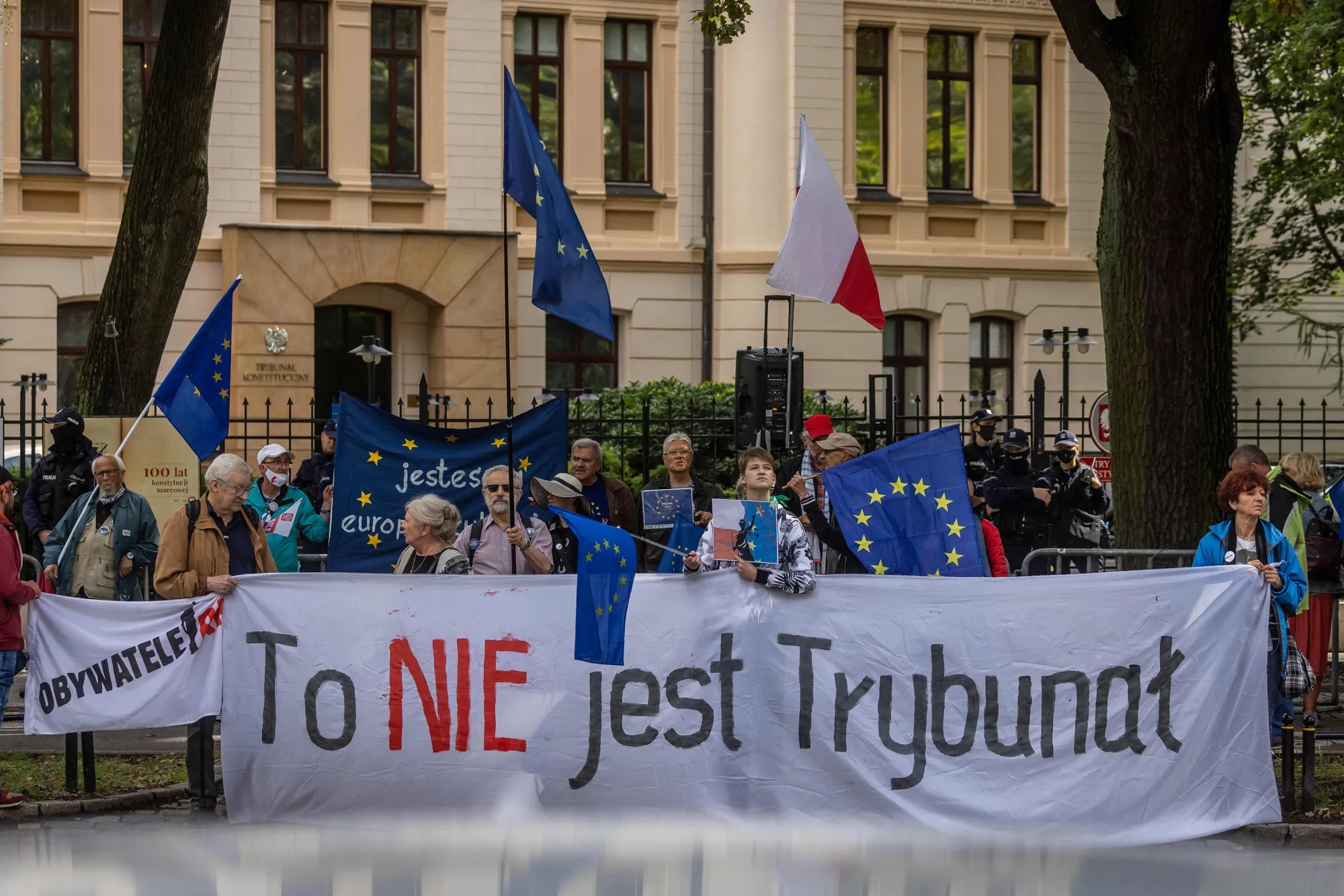 Demonstrators hold a banner reading "This is not a Constitutional Court" during a protest outside the constitutional court in Warsaw, on Aug. 31.
