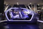 Show attendees sit in the Chrysler Portal self-driving concept car at CES International Thursday, January 5, 2017, in Las Vegas.