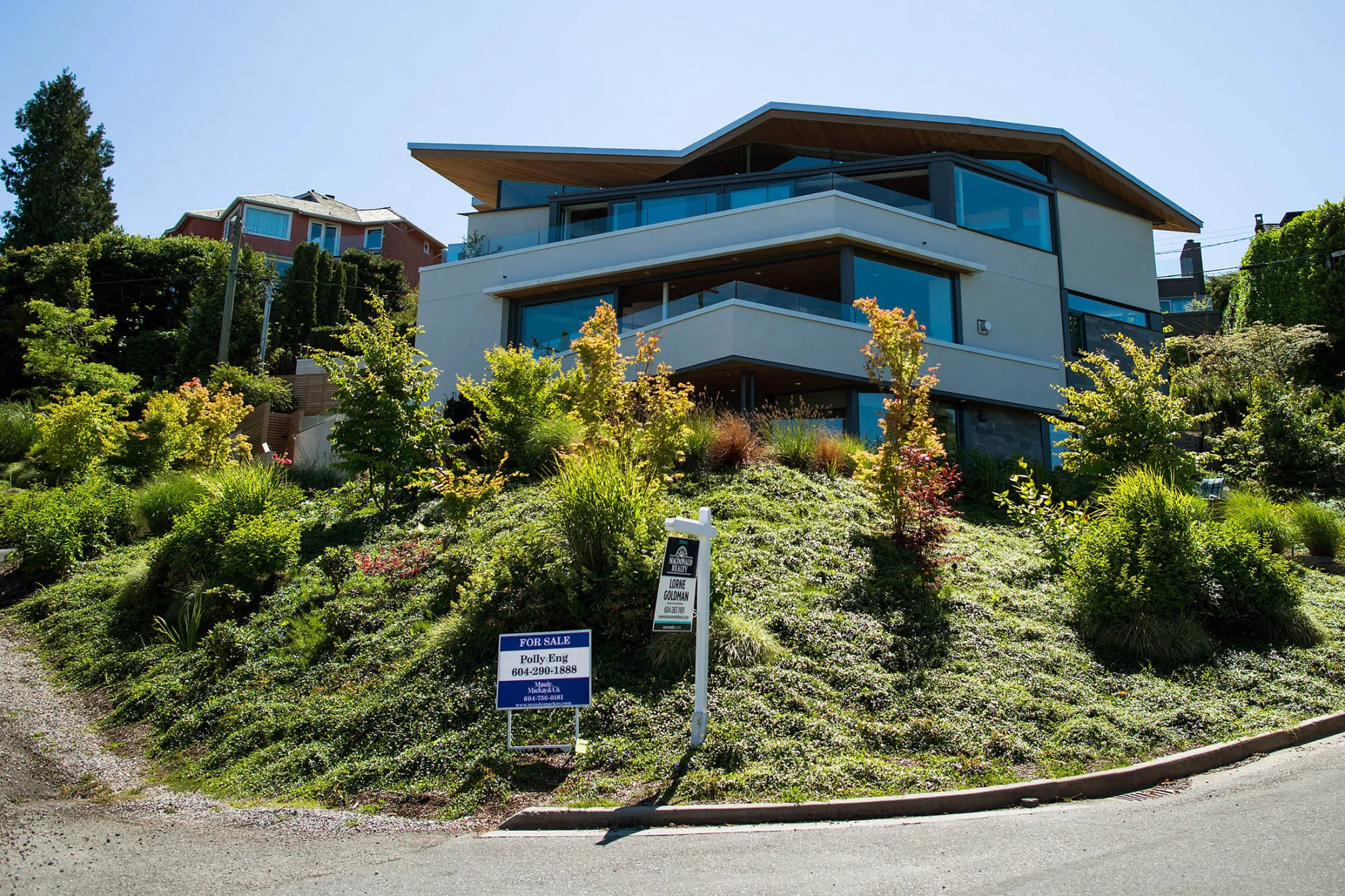 A home for sale listed at C$7.89 million stands in the Point Grey neighborhood of Vancouver, British Columbia, Canada, on Friday, June 17, 2016. Vancouver has long been one of the world's most expensive places to live but price gains have reached a whole new level of intensity this year. Low interest rates, rising immigration, and a surge of foreign money—particularly from China—have all driven the increases.
