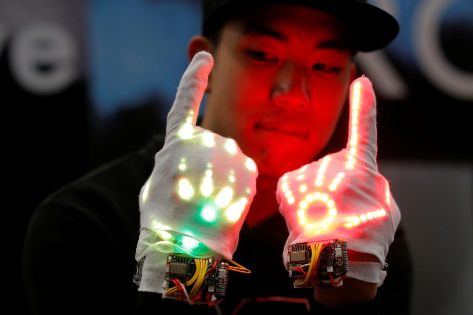 An employee demonstrates the Groove, &quot;a wearable glove device that enhances the dancer's expression,&quot; at the Trade Show at the South by Southwest (SXSW) Music Film Interactive Festival 2017 in Austin, Texas, U.S., March 12, 2017. 
