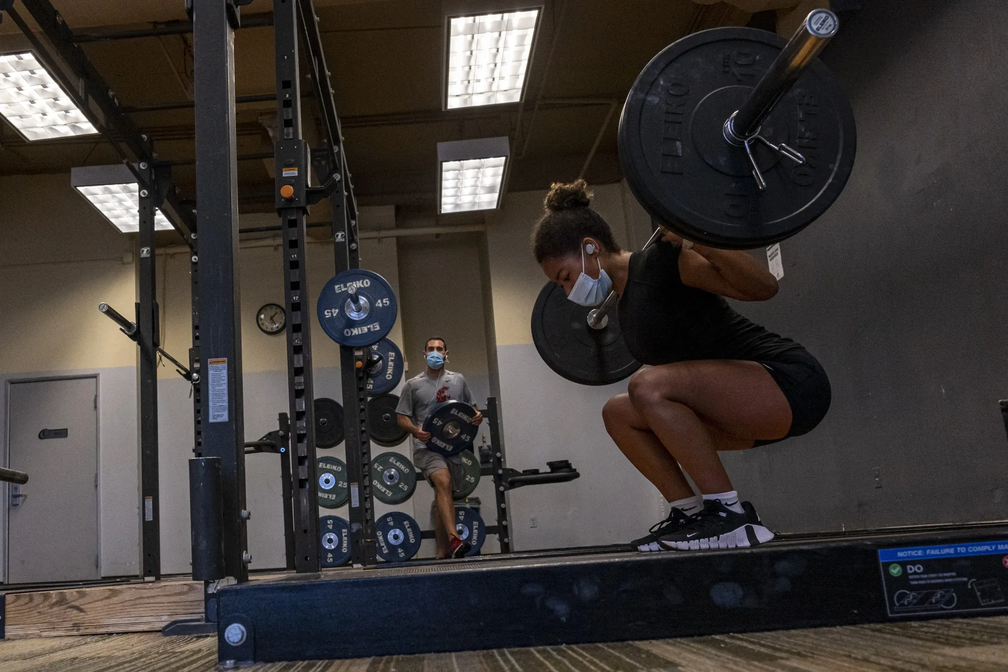People wear masks while exercising&nbsp;at&nbsp;a gym in San Francisco.