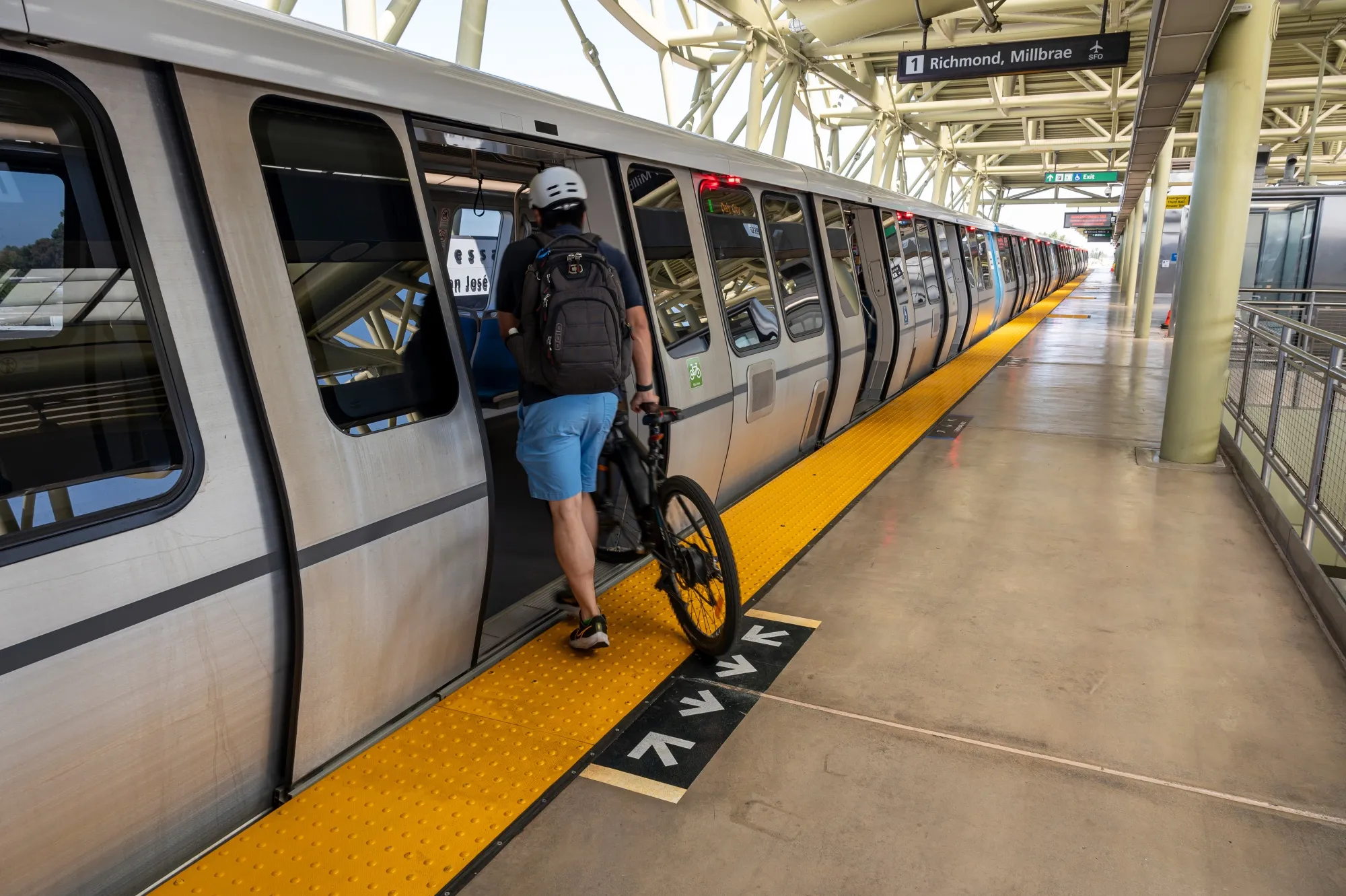 A passenger enters a train at the Berryessa Bay Area Rapid Transit station in Fremont, California.