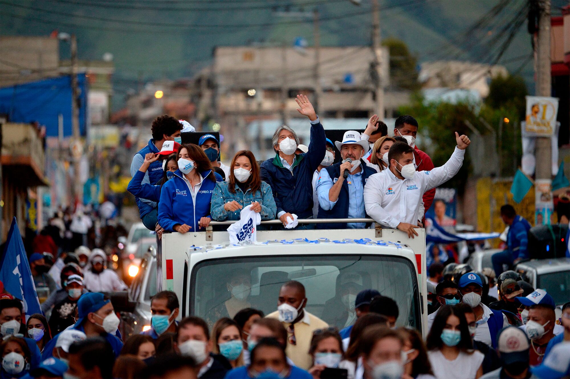 Ecuadorean presidential candidate Guillermo Lasso waves during a campaign rally in Quito on Feb. 3, 2021.