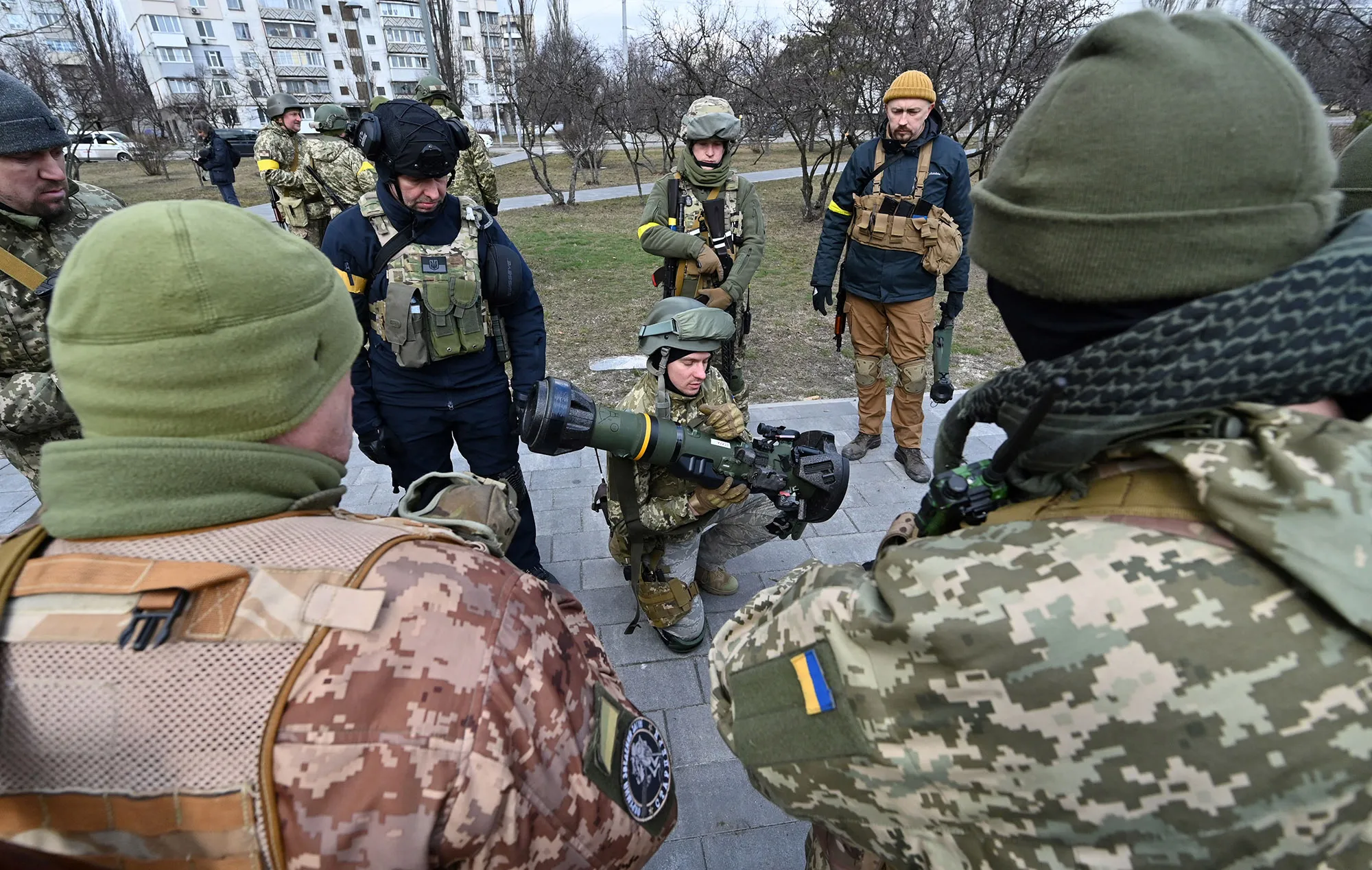 Members of the Ukrainian Territorial Defence Forces examine new armament, including NLAW anti-tank systems and other portable anti-tank grenade launchers, in Kyiv on March 9.