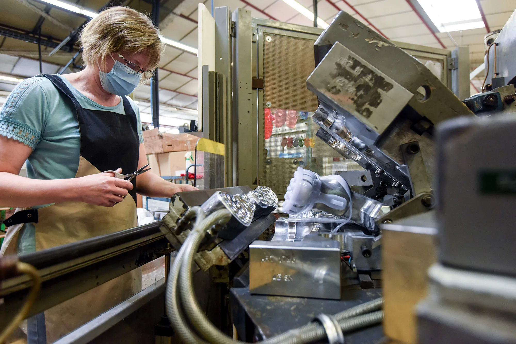 A worker makes plastic beach sandals at a factory, in Beaupreau-en-Mauges, France.&nbsp;