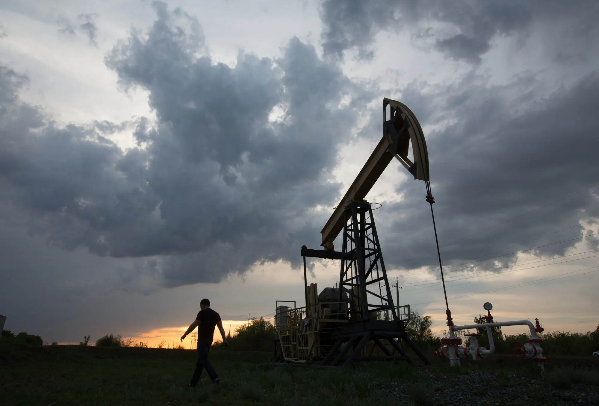 An oil pumping jack operates in an oil field near Samara, Russia.