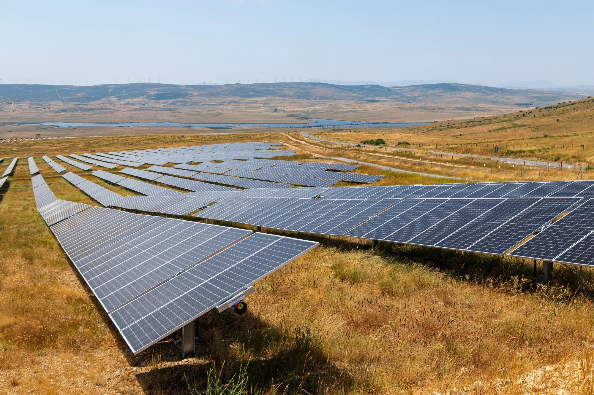 Solar panels at a EDP SA solar farm in Avila, Spain, on Tuesday, July 1, 2025. Big technology companies are driving demand for electricity produced by renewable projects as the firms invest in artificial intelligence and data centers, according to EDP SA, a developer of wind farms and solar energy projects in the US and Europe.