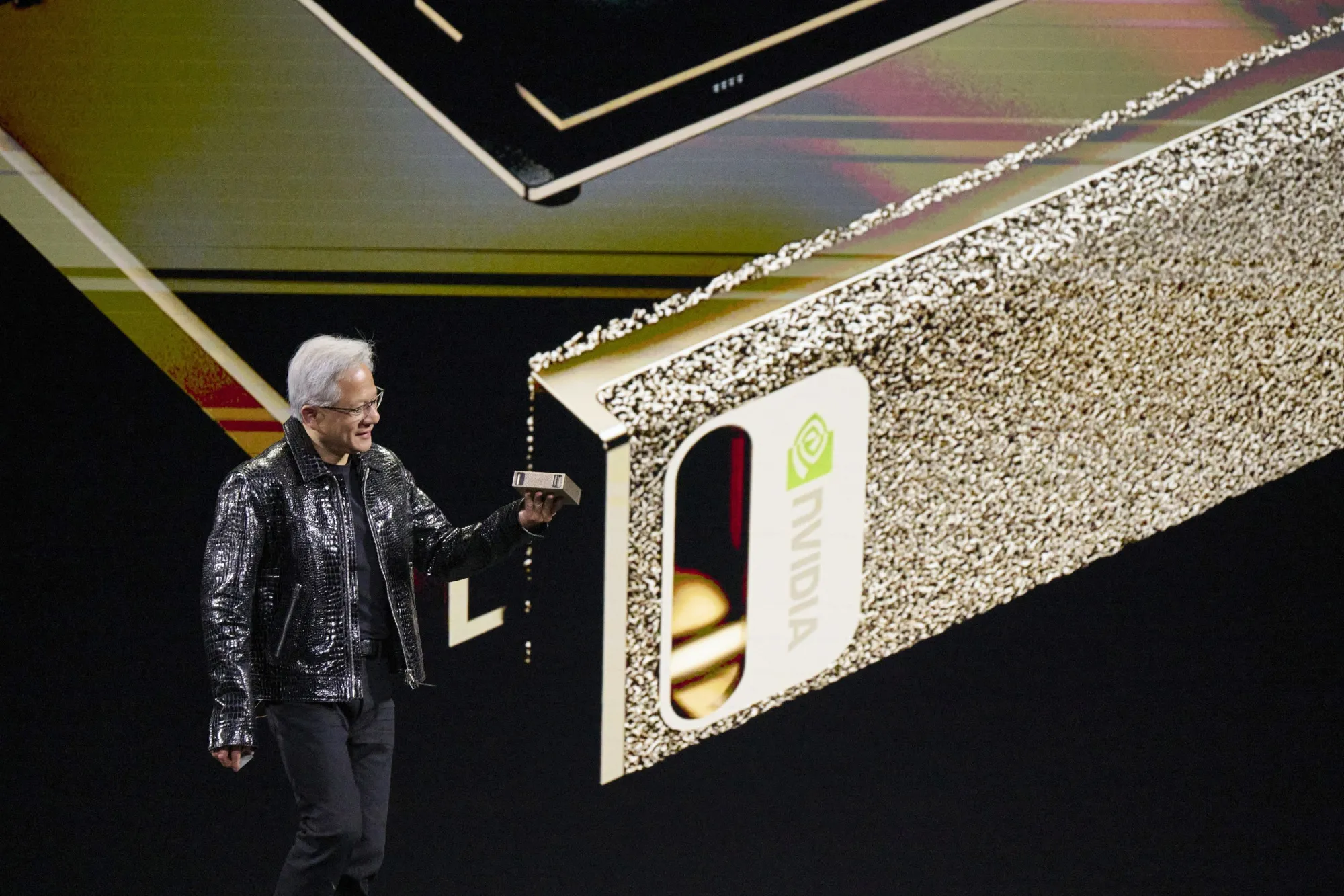 Jensen Huang&nbsp;speaks while holding a Project Digits computer during the 2025 CES event in Las Vegas, Nevada,&nbsp;on&nbsp;Jan. 6.