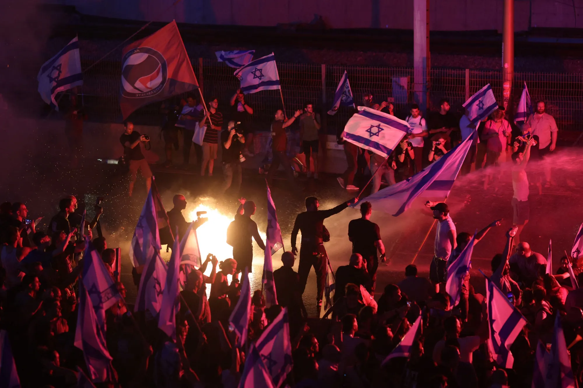 Police use water cannon to disperse anti-government protesters in Tel Aviv on July 5.