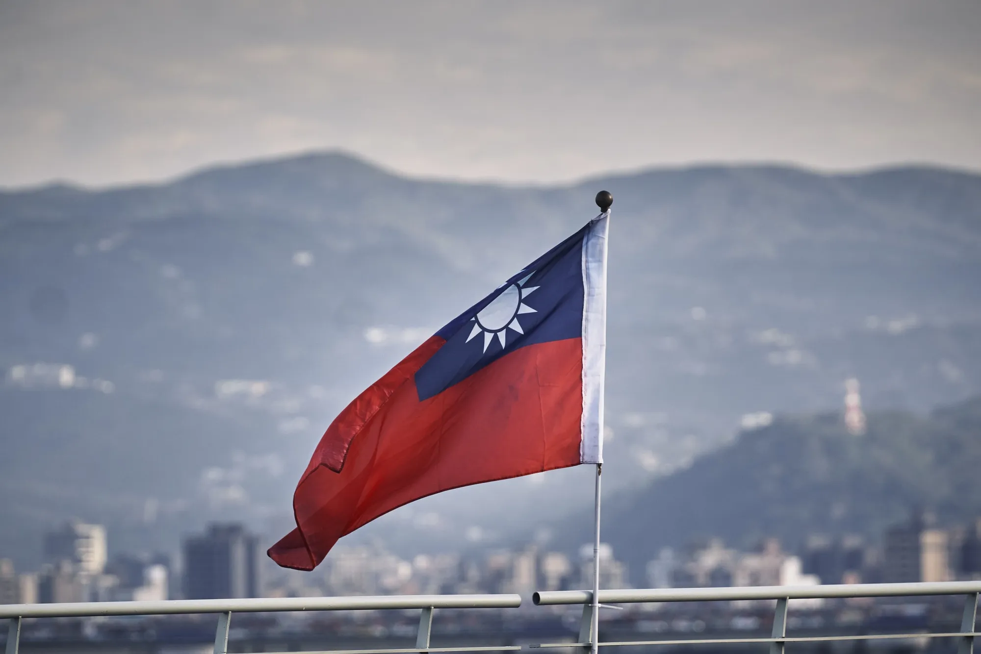A Taiwanese flag on a bridge in Taipei.