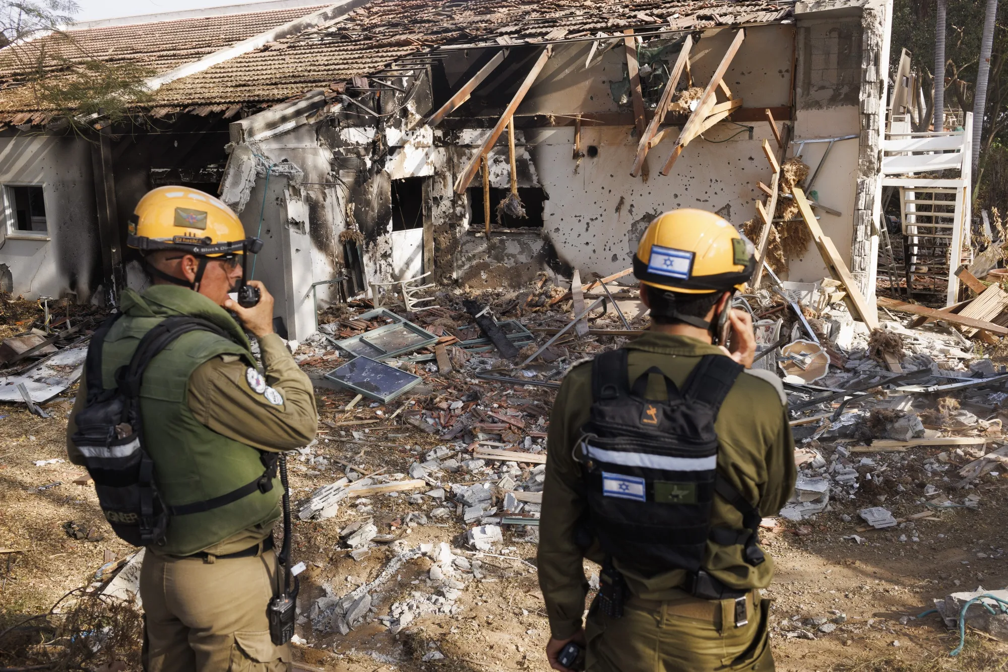 Israeli rescuers search for the bodies of those killed during an attack by Hamas militants in Kibbutz Be'eri on Oct. 22, 2023.