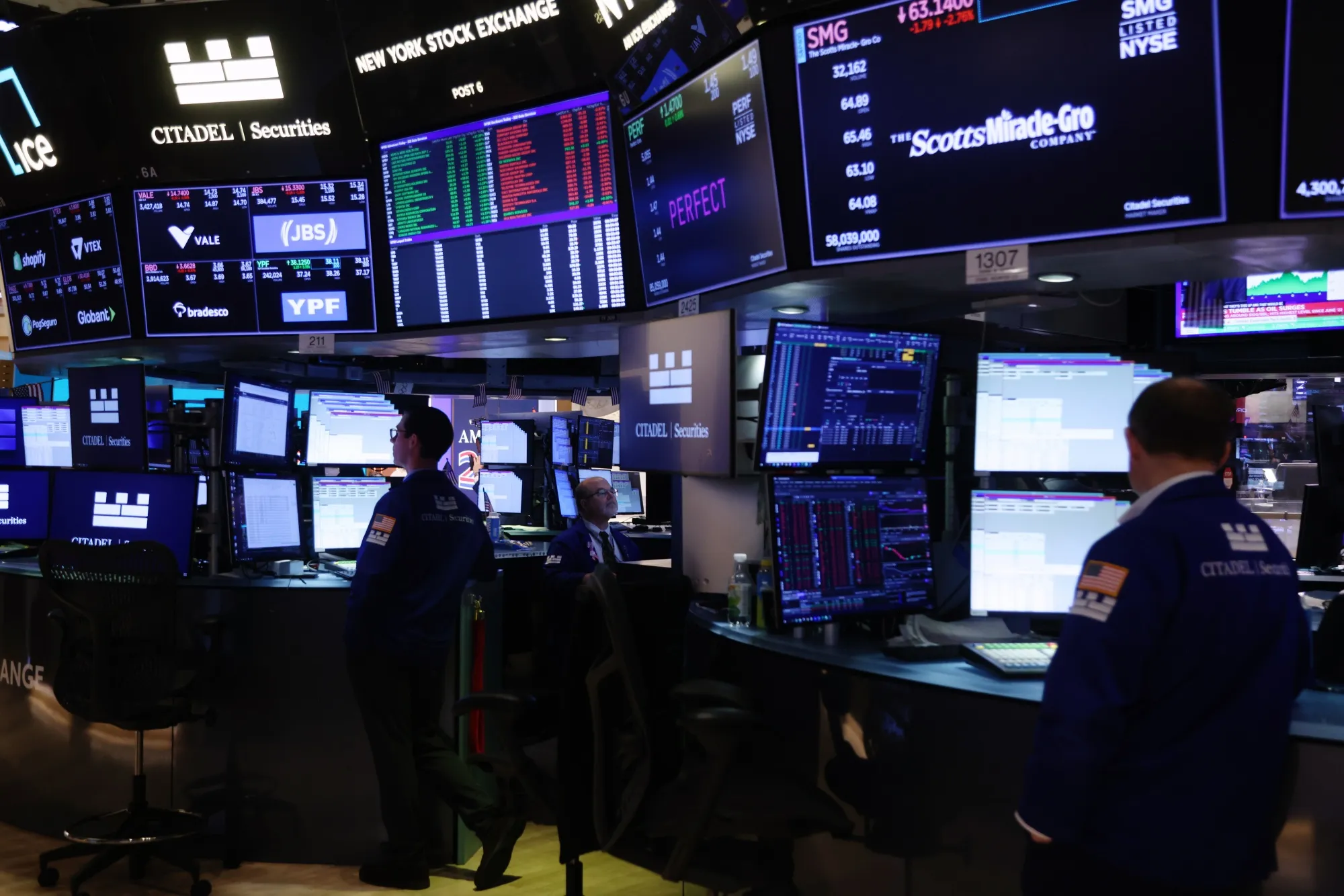 Traders work on the floor at the New York Stock Exchange.