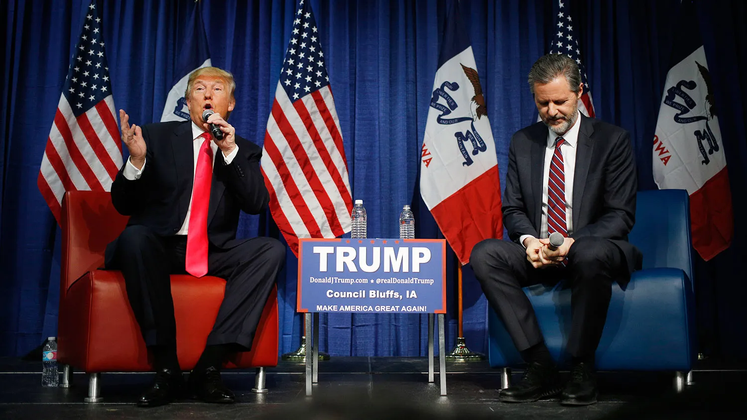 Donald Trump speaks on stage with Jerry Falwell Jr. during a campaign rally at the Gerald W. Kirn Middle School in Council Bluffs, Iowa, on Jan. 31, 2016.
