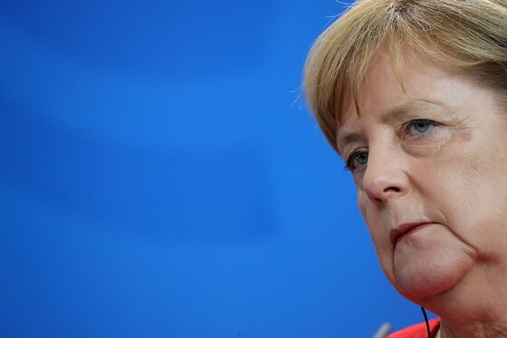 Merkel Says Germany Will Cut Debt and Raise Investment Next Year