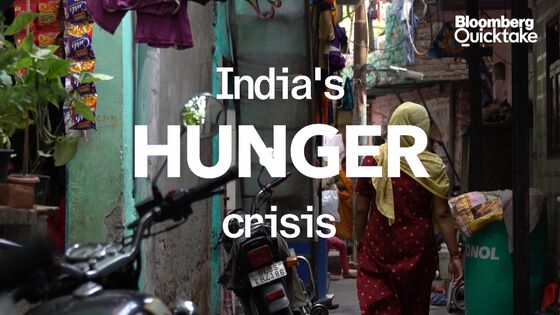 Hunger Crisis Forces Even Middle-Class Indians to Line Up for Rations