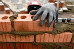 A construction worker lays bricks at a Persimmon Plc residential property construction site in Cranfield, U.K., on Tuesday, Jan. 6, 2016. The average price of a home rose 0.8 percent to 196,999 pounds ($292,100) from November, the most since April, Nationwide Building Society said in a statement released at the end of December.
