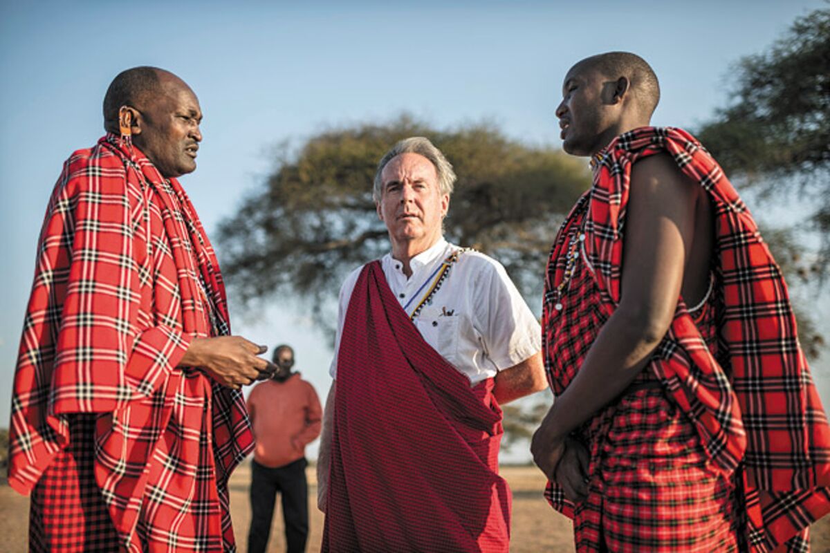 Three Maasai men wearing the distinctive shuka cloth in Kenya