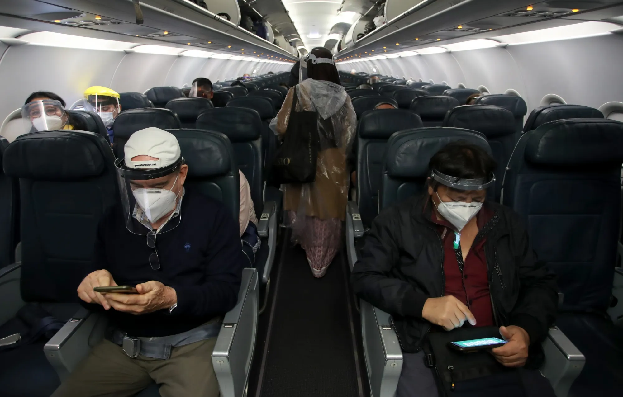 Passengers sit on a plane before a flight from Lima to Trujillo, Peru.&nbsp;