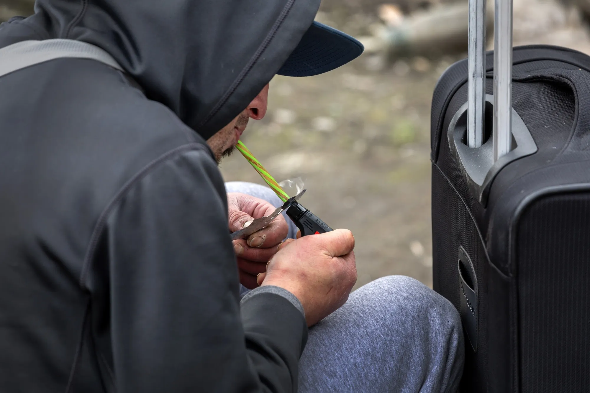A homeless man smokes fentanyl, a synthetic opioid.&nbsp;
