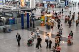 Travelers at Beijing Capital International Airport.