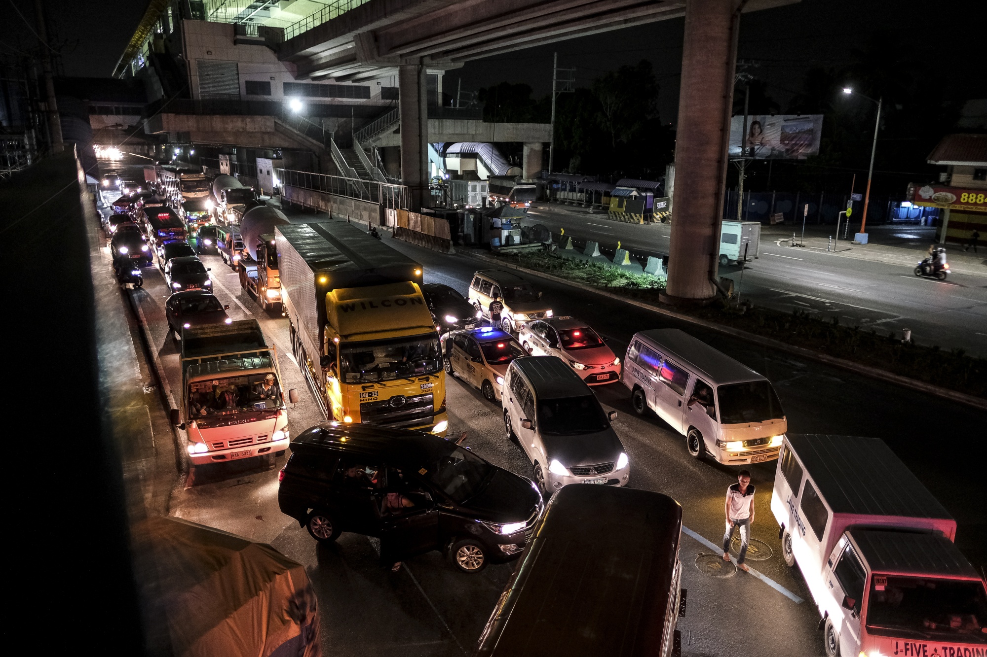 Vehicles sit in traffic at a quarantine checkpoint area in Cainta City, Metro Manila, the Philippines, on&nbsp;March 15.