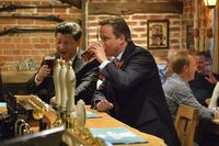China's President Xi Jinping (left) and Britain's Prime Minister David Cameron share a pint at a pub near Chequers, the prime minister’s country residence northwest of London, in 2015.