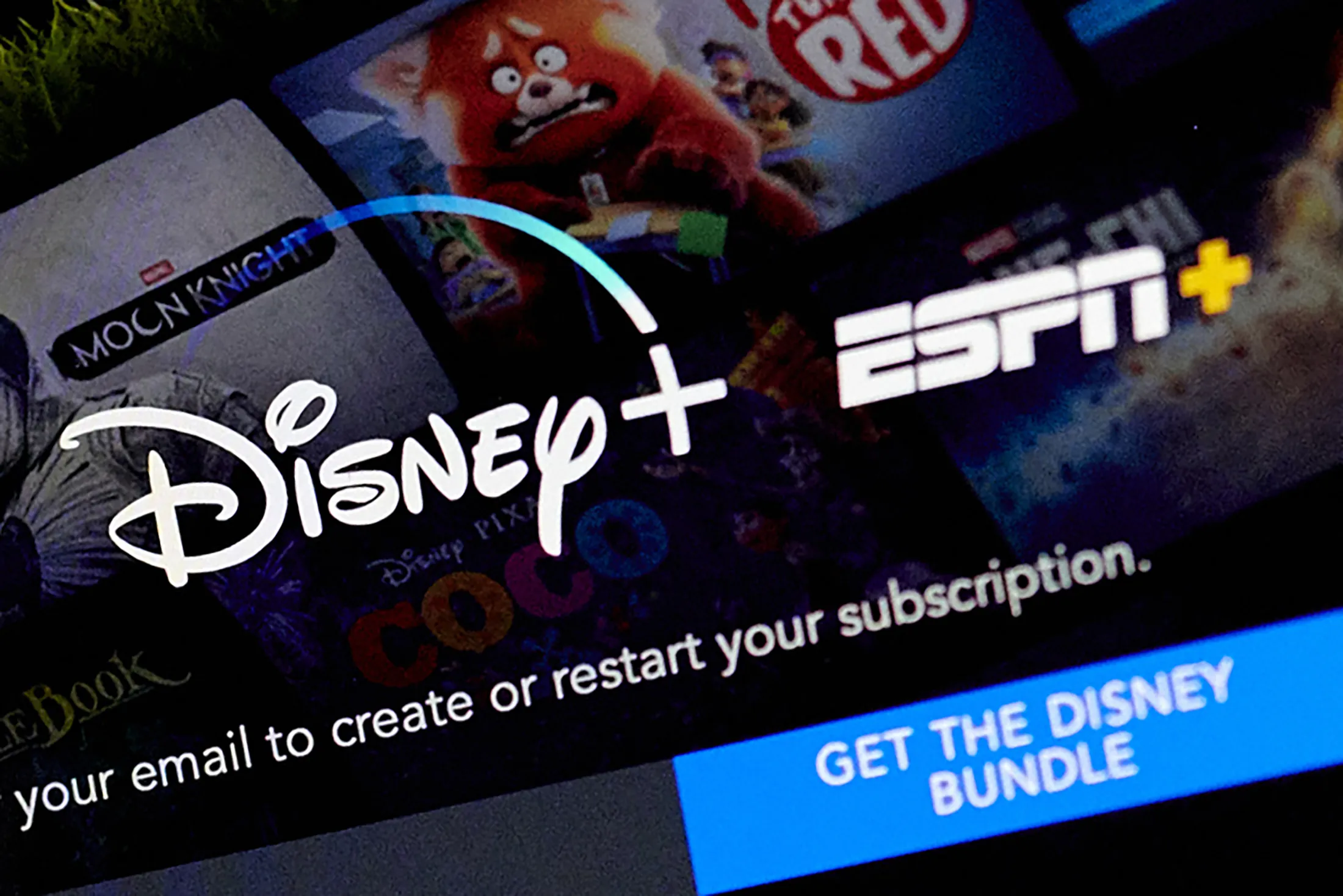 The Disney+ and ESPN+ logo. on a laptop computer.