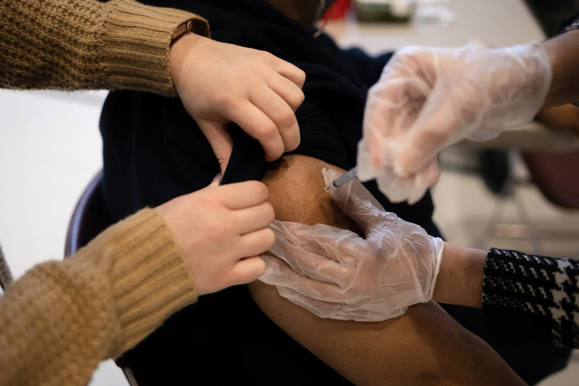 A resident receives a Covid-19 booster shot at a vaccine clinic in Lansdale, Pennsylvania.