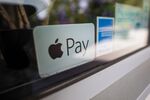 A sticker advertises Apple Pay as an accepted payment method at a restaurant in Norwich, U.K., on Tuesday, June 9, 2020. 