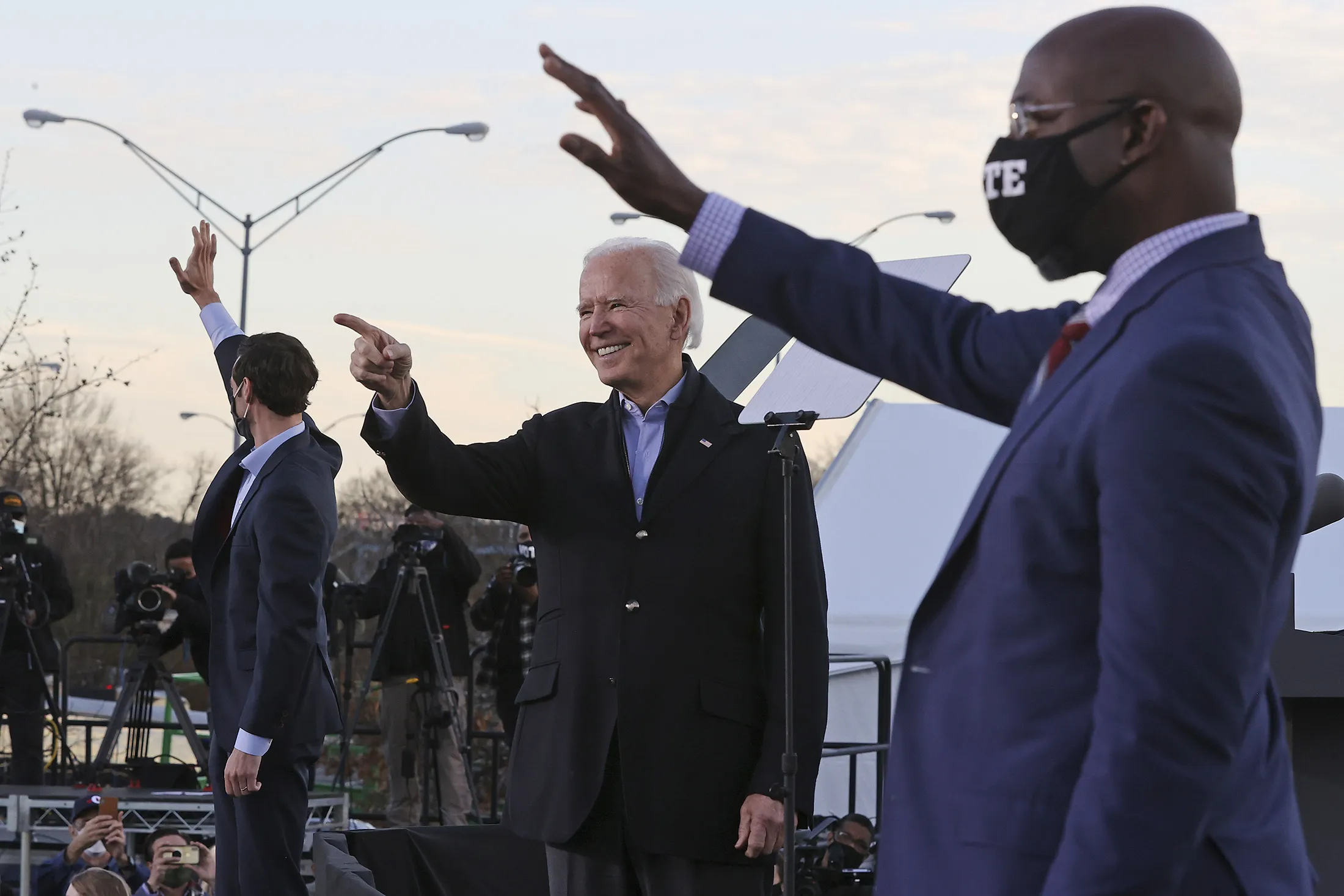 Joe Biden with&nbsp;with Raphael Warnock, right, and&nbsp;Jon Ossoff in Atlanta, on Jan. 4.&nbsp;