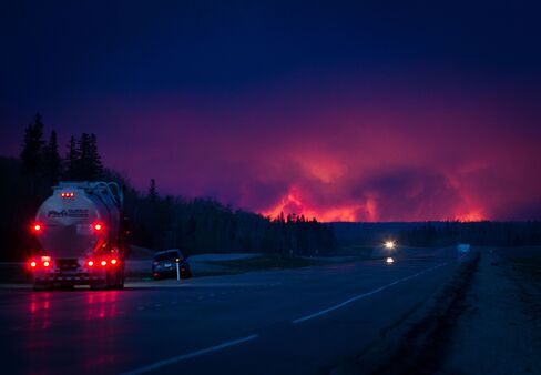 Wildfire burns south of Fort McMurray, Alberta on Wednesday.