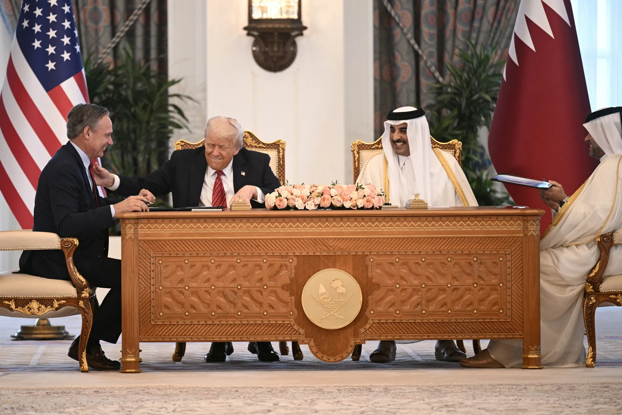 Boeing CEO Kelly Ortberg, from left, US President Donald Trump and Qatar’s Emir Sheikh Tamim bin Hamad al-Thani at a deal-signing ceremony in Doha in May.
