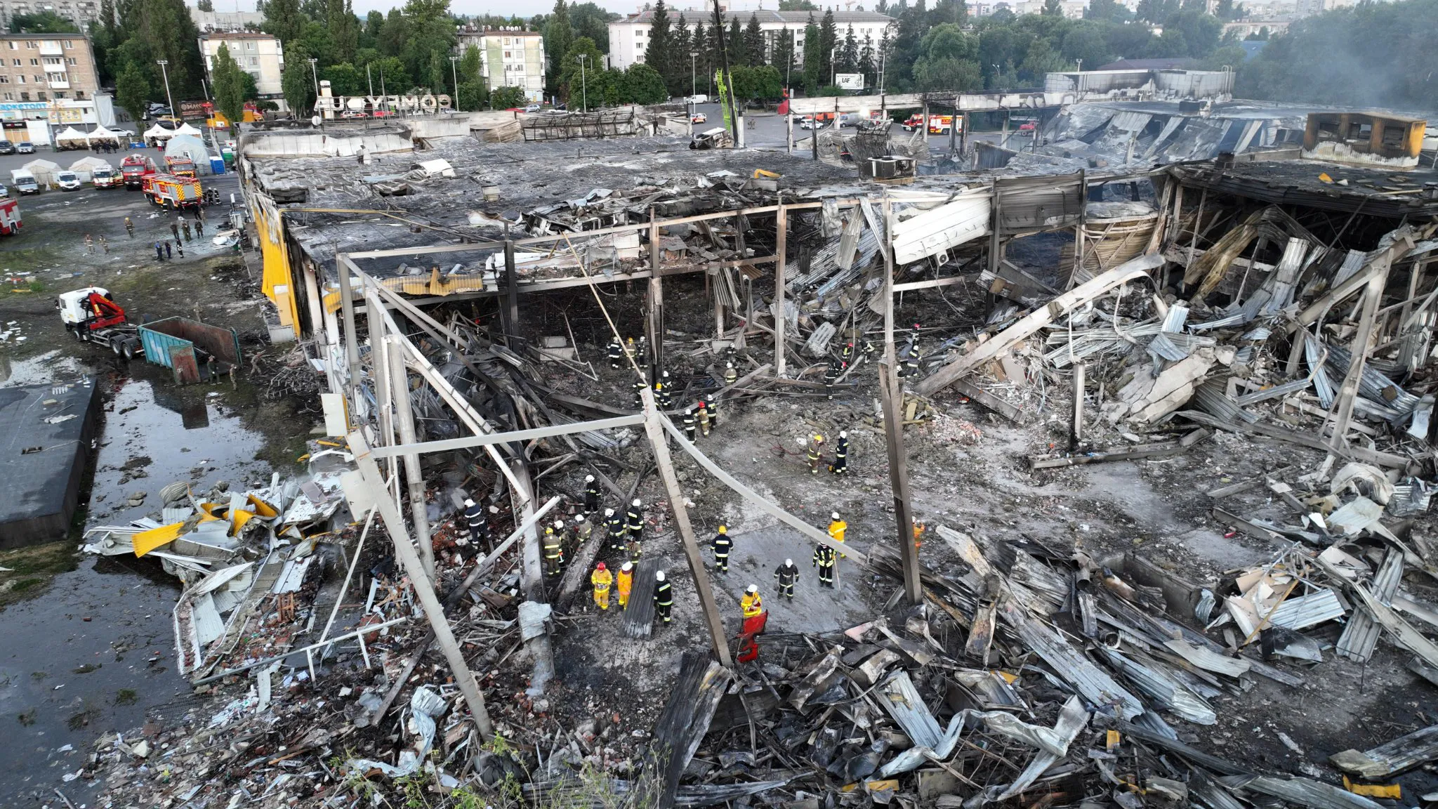 Emergency services a destroyed&nbsp;mall&nbsp;following a Russian missile attack&nbsp;in Kremenchuk&nbsp;on June 28.