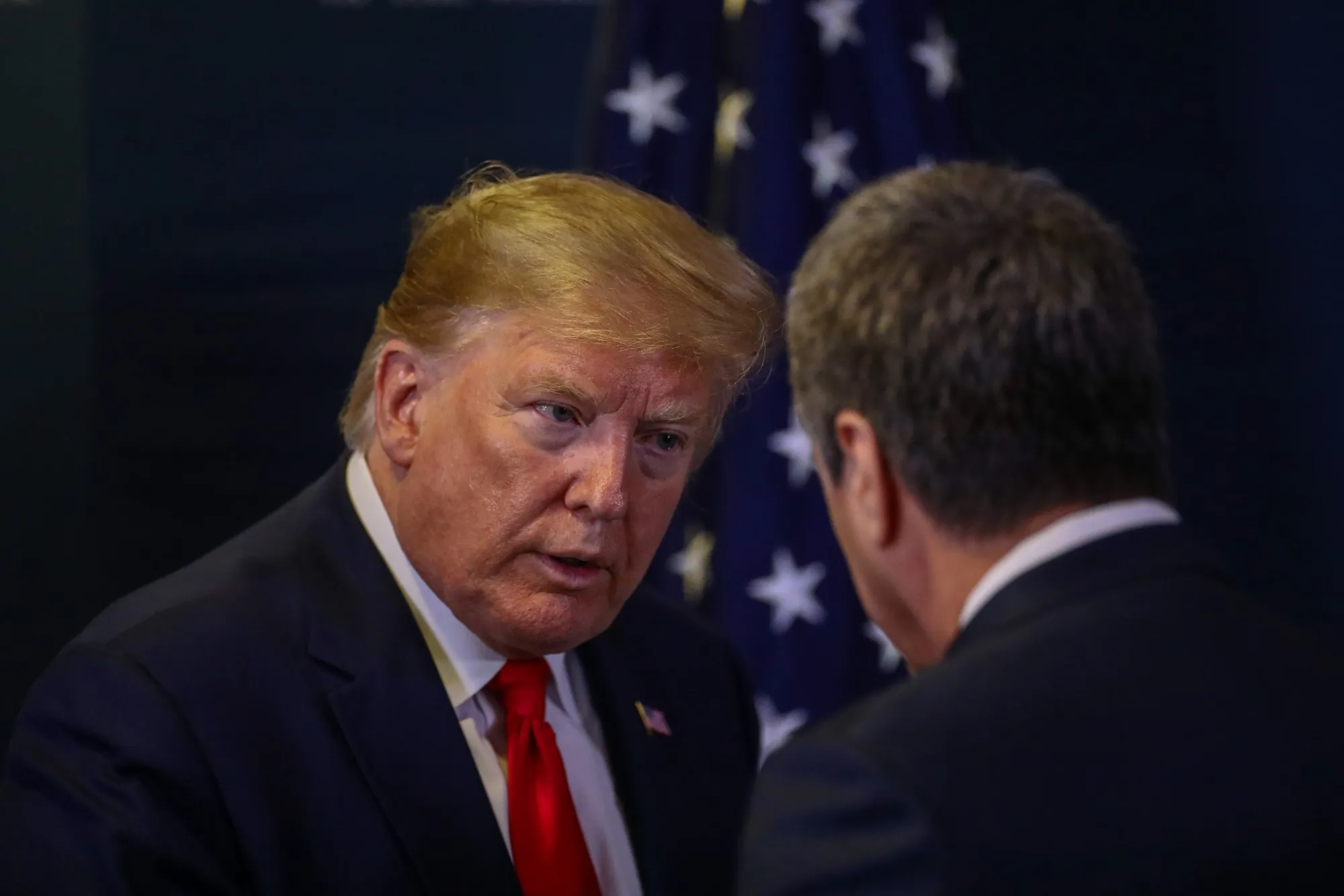 Donald Trump, left, speaks to Roberto Azevedo during a news conference&nbsp;in Davos, Switzerland, on Jan. 22.&nbsp;