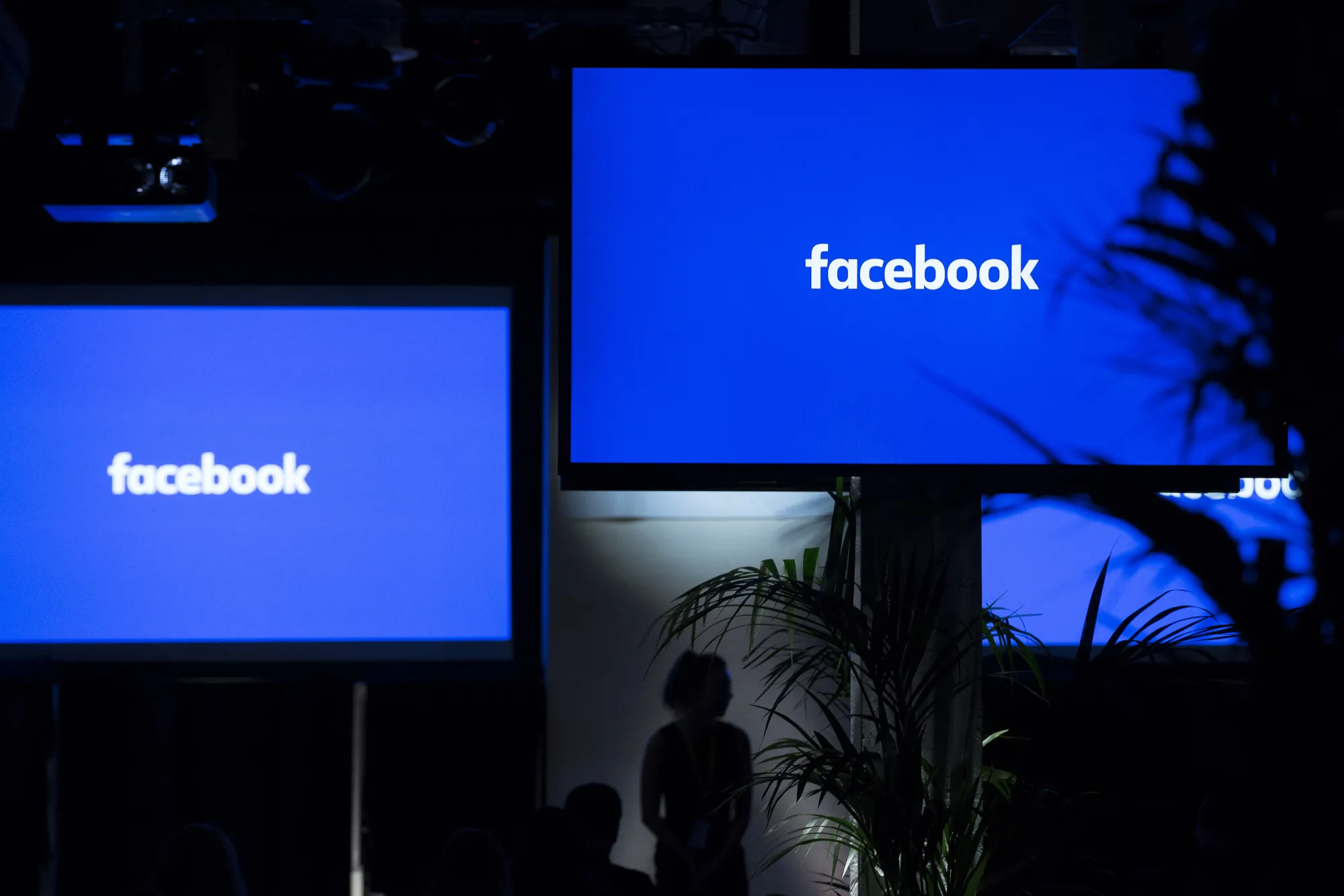 The Facebook Inc. logo sits on screens ahead of the global launch event of "Workplace" at the Facebook Inc. offices in London, U.K., on Monday, Oct. 10, 2016.
