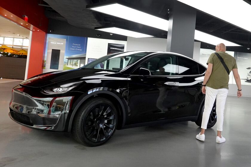 Electric Car Maker Tesla Reports Record Quarterly Earnings