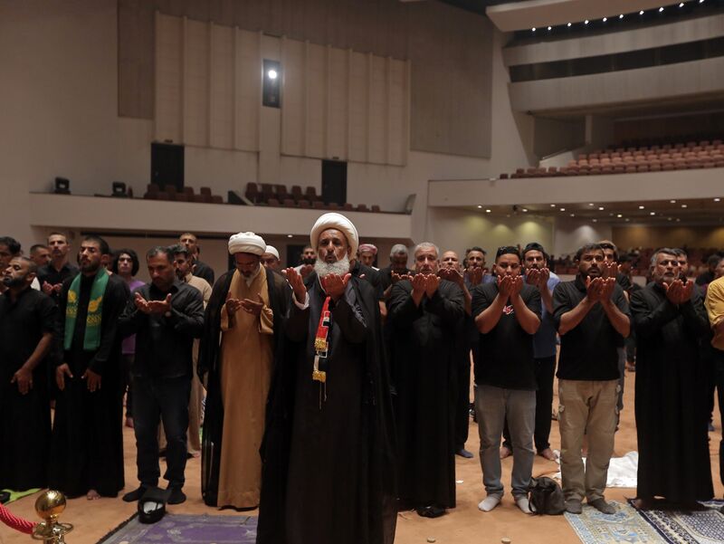 Followers of Shiite cleric Muqtada al-Sadr pray during a sit-in at the parliament in Baghdad, on July 31.