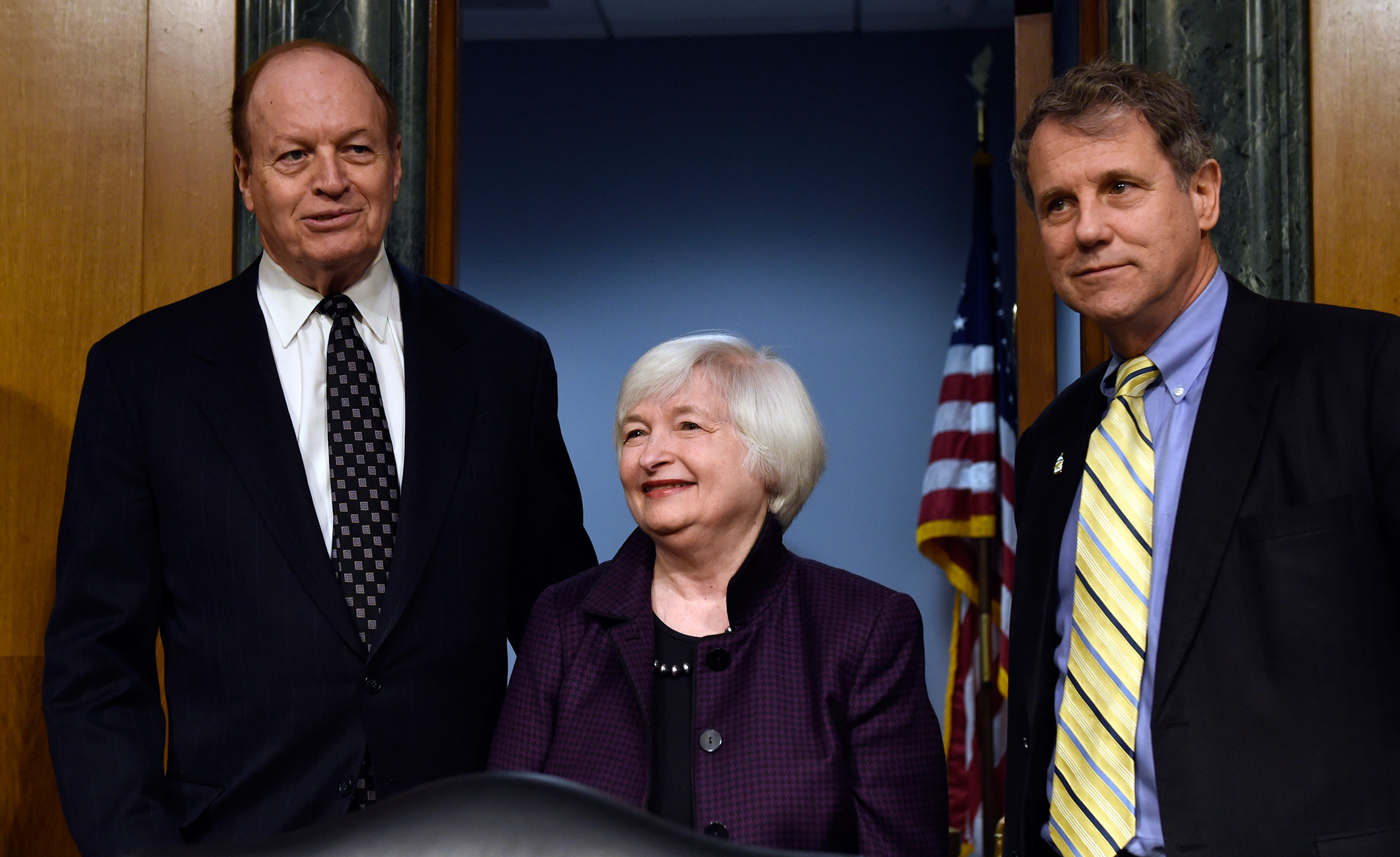Senate Banking Committee Chairman Sen. Richard Shelby, R-Ala., left, and the committee's ranking member Sen. Sherrod Brown, D-Ohio, right, with Federal Reserve Board Chair Janet Yellen on Capitol Hill in Washington, on Feb. 24, 2015.
