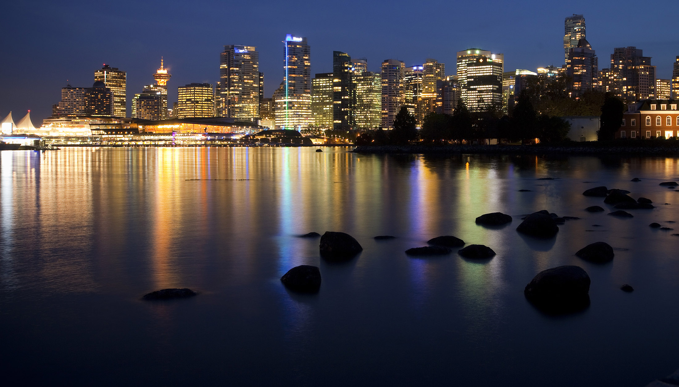 The city skyline is seen at night from Stanley Park in Vancouver, British Columbia, Canada.
