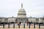 Pedestrians walk on Capitol Hill in Washington, DC, US, on Thursday, Nov. 27, 2025. President Donald Trump ordered an additional 500 troops deployed to the nation's capital after a pair of National Guardsmen were shot just blocks from the White House and left in critical condition on Wednesday.