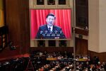 Xi Jinping, China's president, is seen on a screen as he speaks at the closing of the First Session of the 13th National People's Congress (NPC).