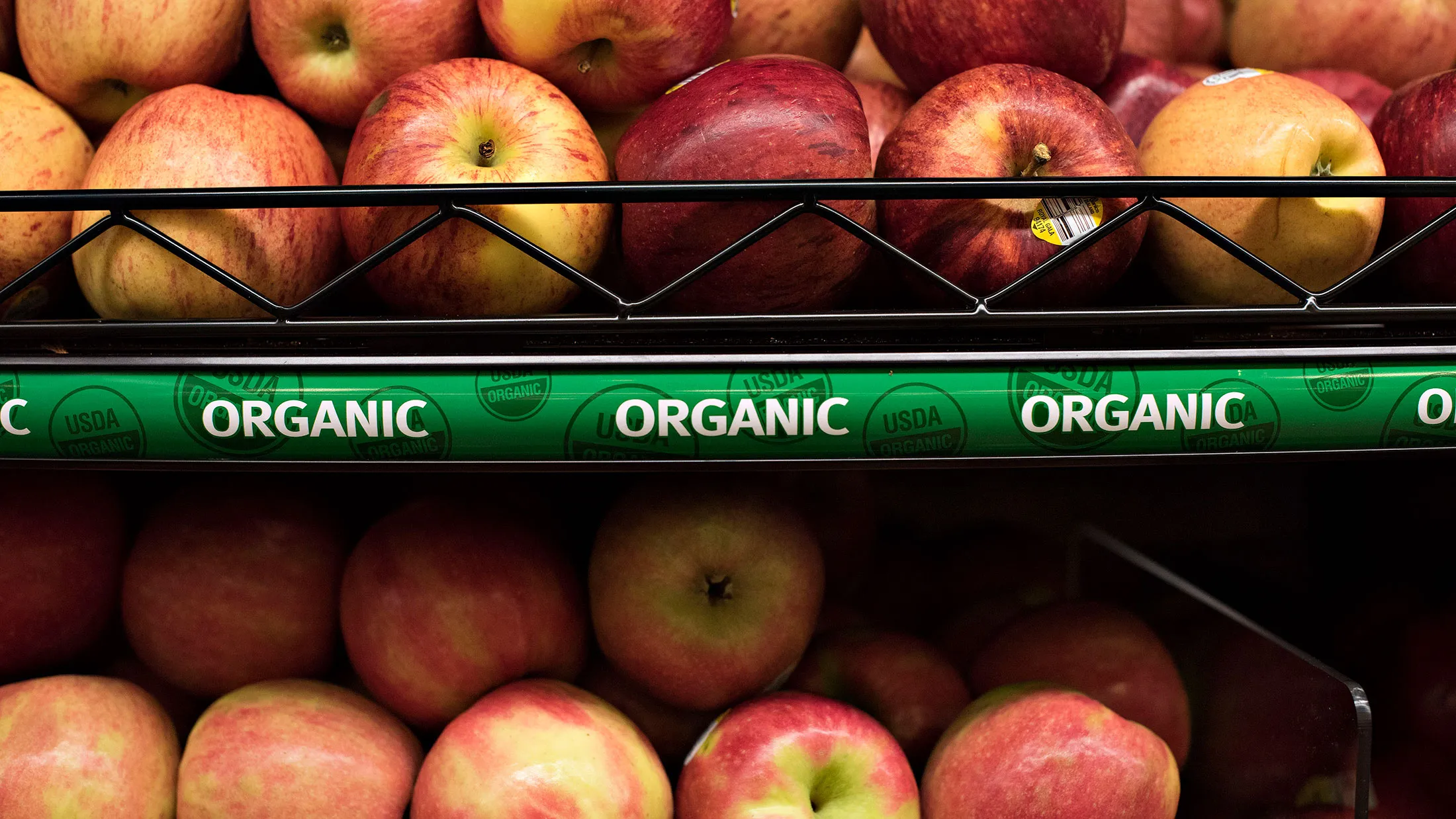 Organic apples are displayed for sale at a Kroger Co. store in Peoria, Illinois, on June 16, 2015.
