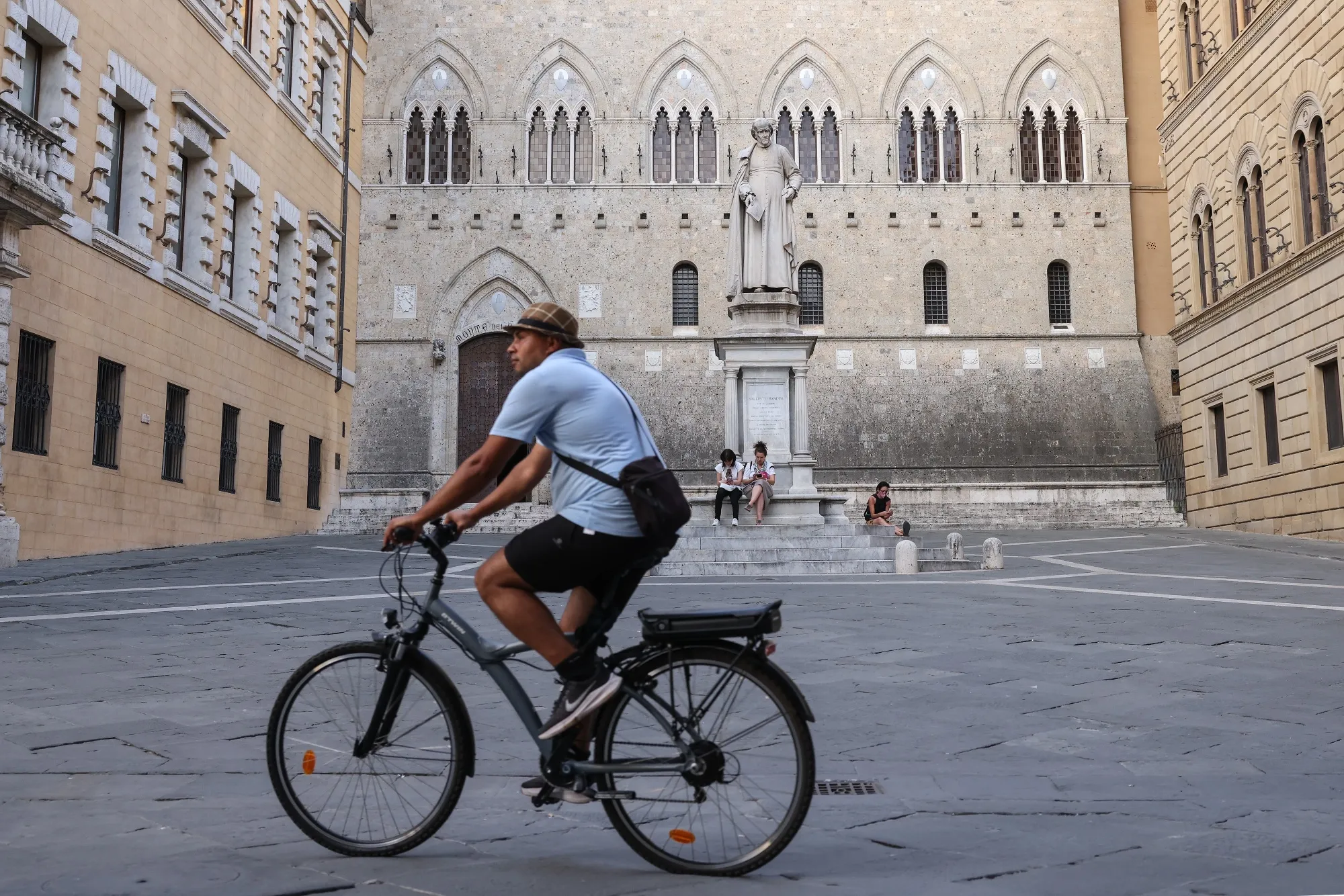 The statue of Sallustio Bandini, an economist and politician, in front of Banca Monte dei Paschi di Siena SpA bank headquarters in Siena, Italy.