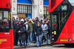 Commuters wait for buses near Liverpool Street railway station in London, on March 3.